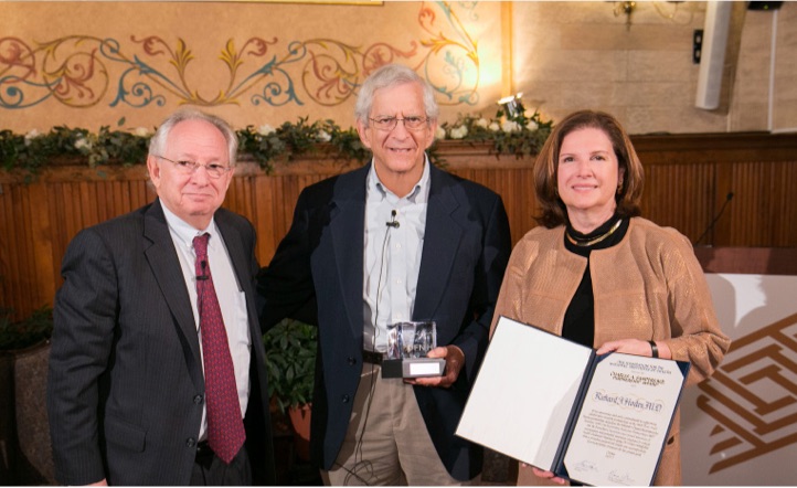 NIA Director Dr. Richard Hodes receiving a Charles A. Sanders, M.D., Partnership Award in 2017